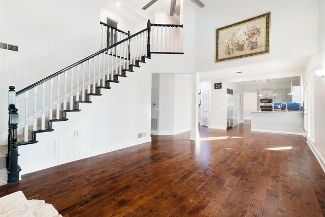 a bathroom with a tub shower and sink