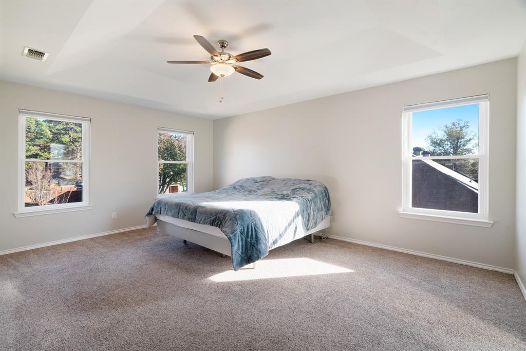635 Cedar Creek Drive Reno, TX 75462 - Photo 13 of 32 a spacious bedroom with a bed and a window