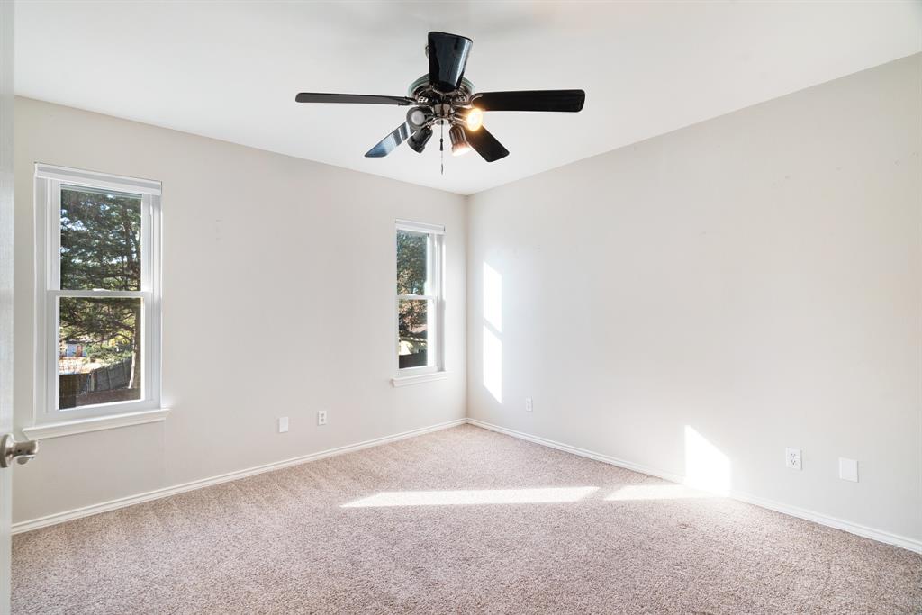635 Cedar Creek Drive Reno, TX 75462 - Photo 17 of 32 an empty room with windows and fan