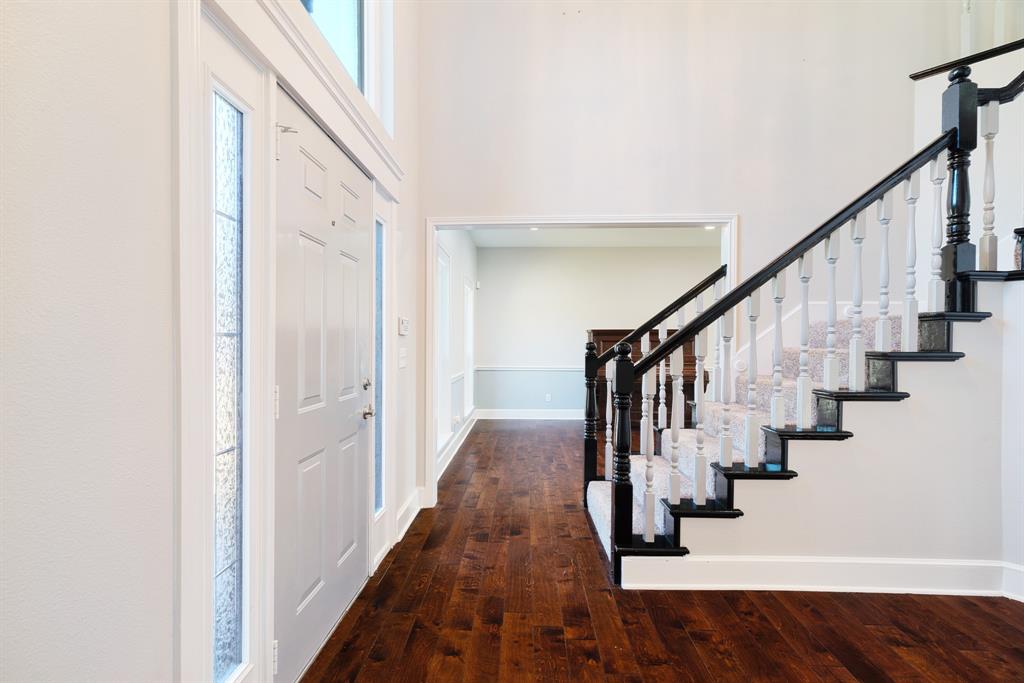 635 Cedar Creek Drive Reno, TX 75462 - Photo 2 of 32 a view of a hallway with wooden floor and entryway