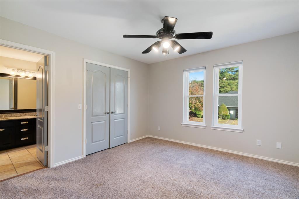 635 Cedar Creek Drive Reno, TX 75462 - Photo 21 of 32 an empty room with windows and fan