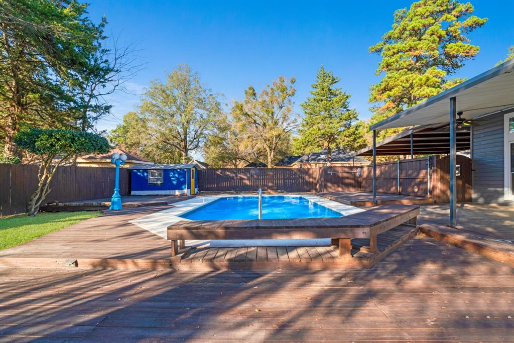 635 Cedar Creek Drive Reno, TX 75462 - Photo 29 of 32 a view of a backyard with wooden fence