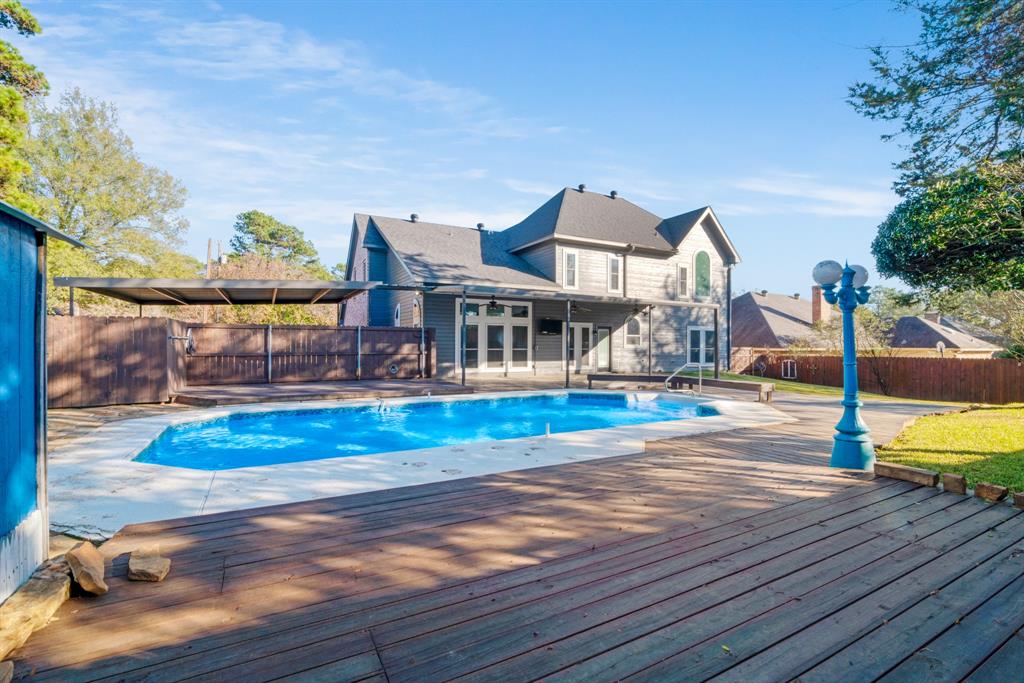 635 Cedar Creek Drive Reno, TX 75462 - Photo 30 of 32 a view of a swimming pool with a lounge chairs