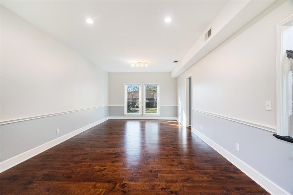 635 Cedar Creek Drive Reno, TX 75462 - Photo 5 of 32 a view of empty room with wooden floor and fan