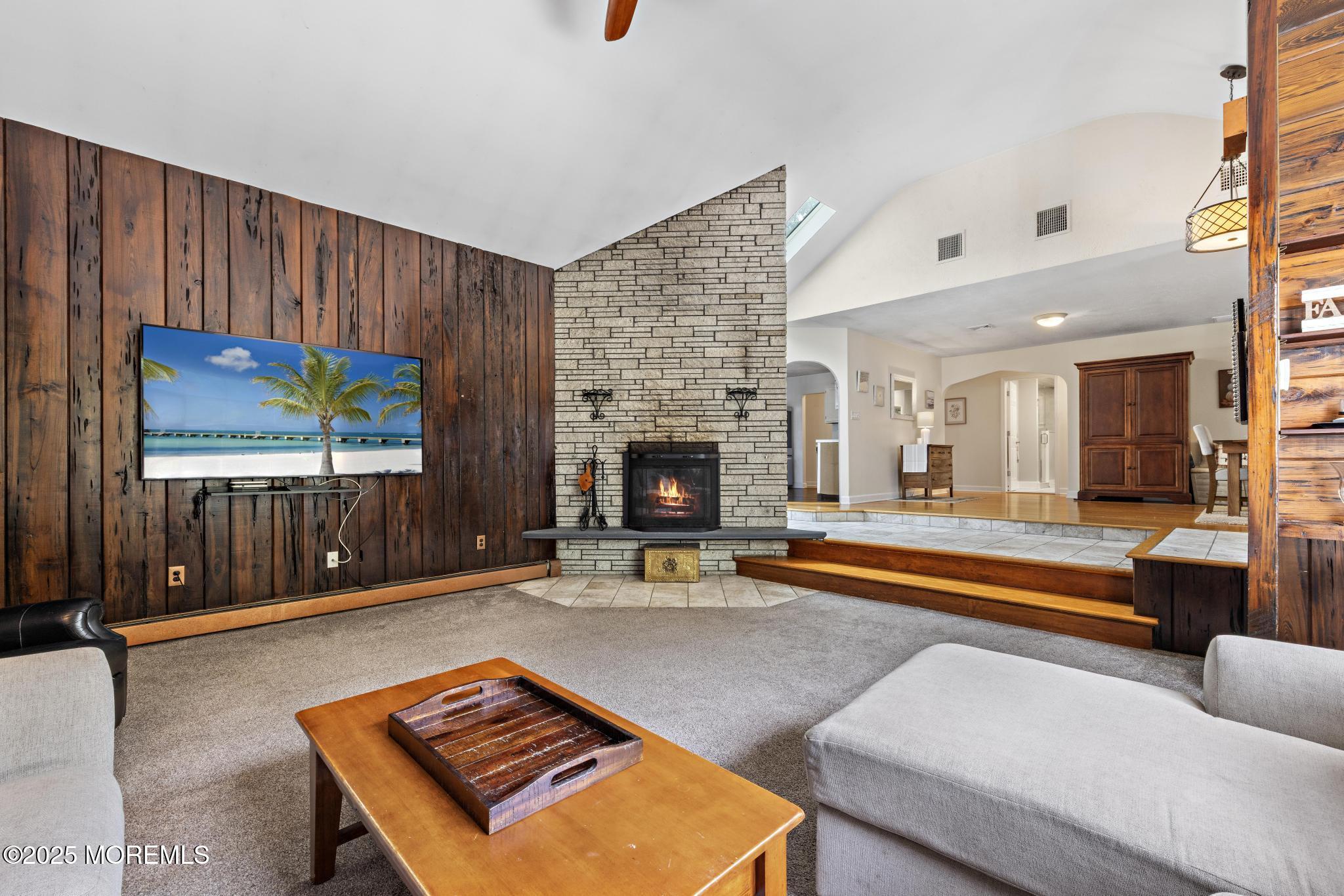 113 Parker Road West Long Branch, NJ 07764 - Photo 20 of 62 a living room with furniture a flat screen tv and a fireplace