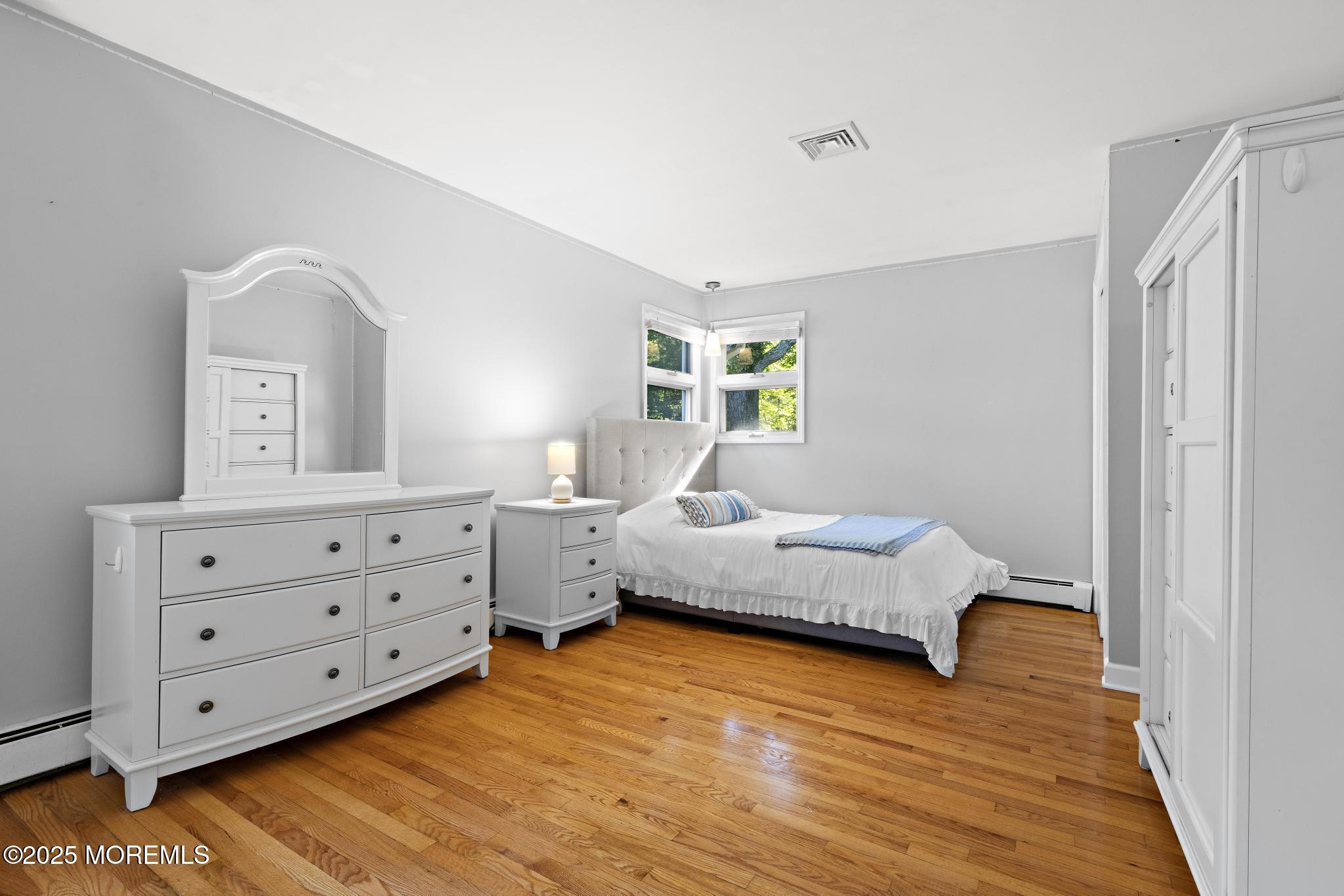 113 Parker Road West Long Branch, NJ 07764 - Photo 38 of 62 a bedroom with natural light and a bed