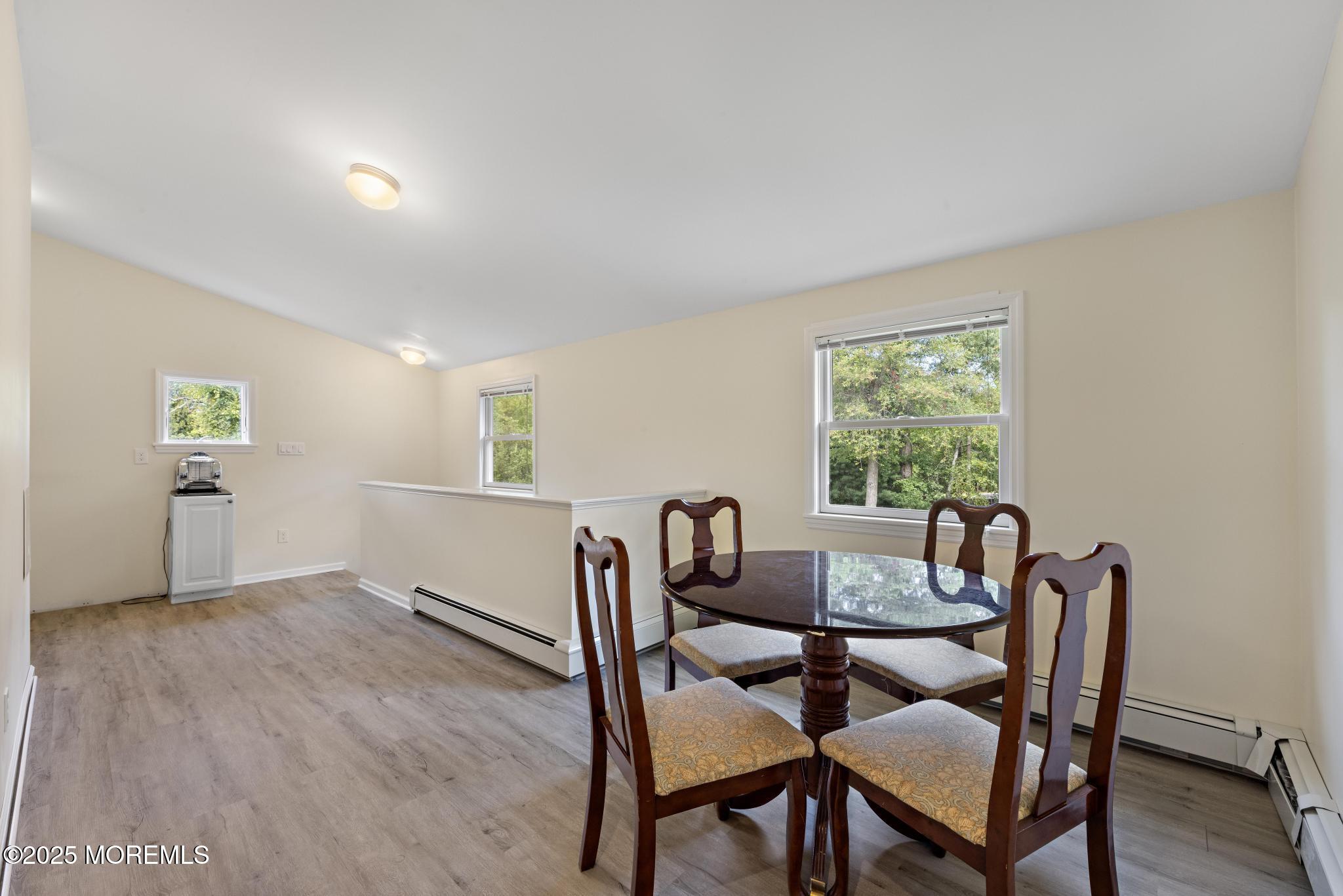 113 Parker Road West Long Branch, NJ 07764 - Photo 44 of 62 a view of a dining room with furniture and wooden floor