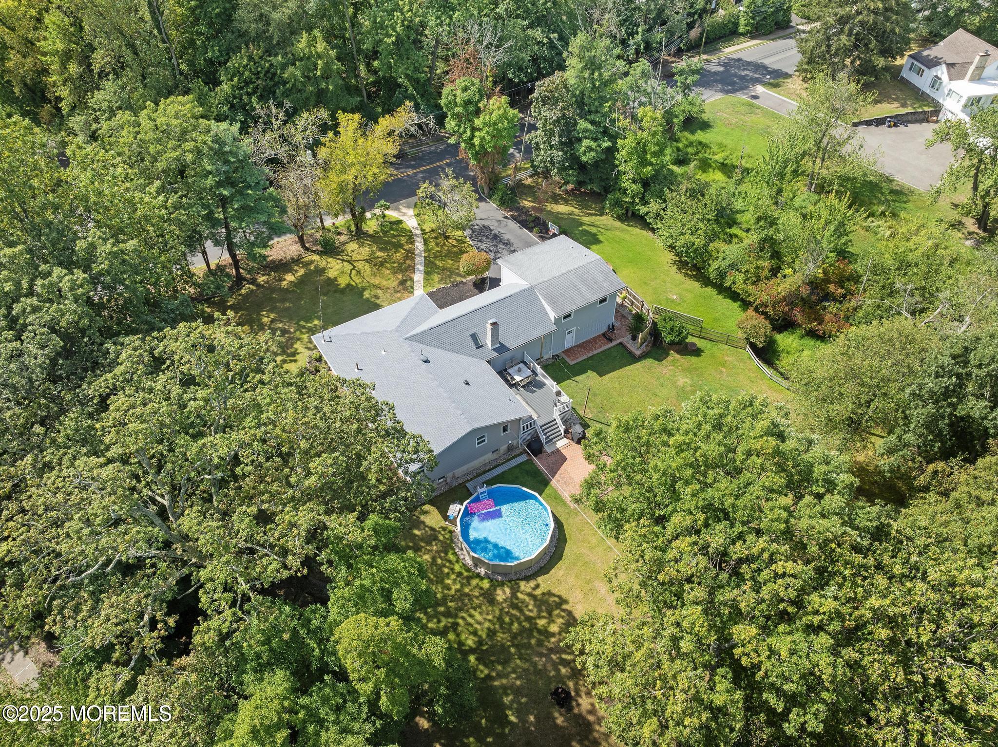 113 Parker Road West Long Branch, NJ 07764 - Photo 56 of 62 an aerial view of a house with a yard and swimming pool