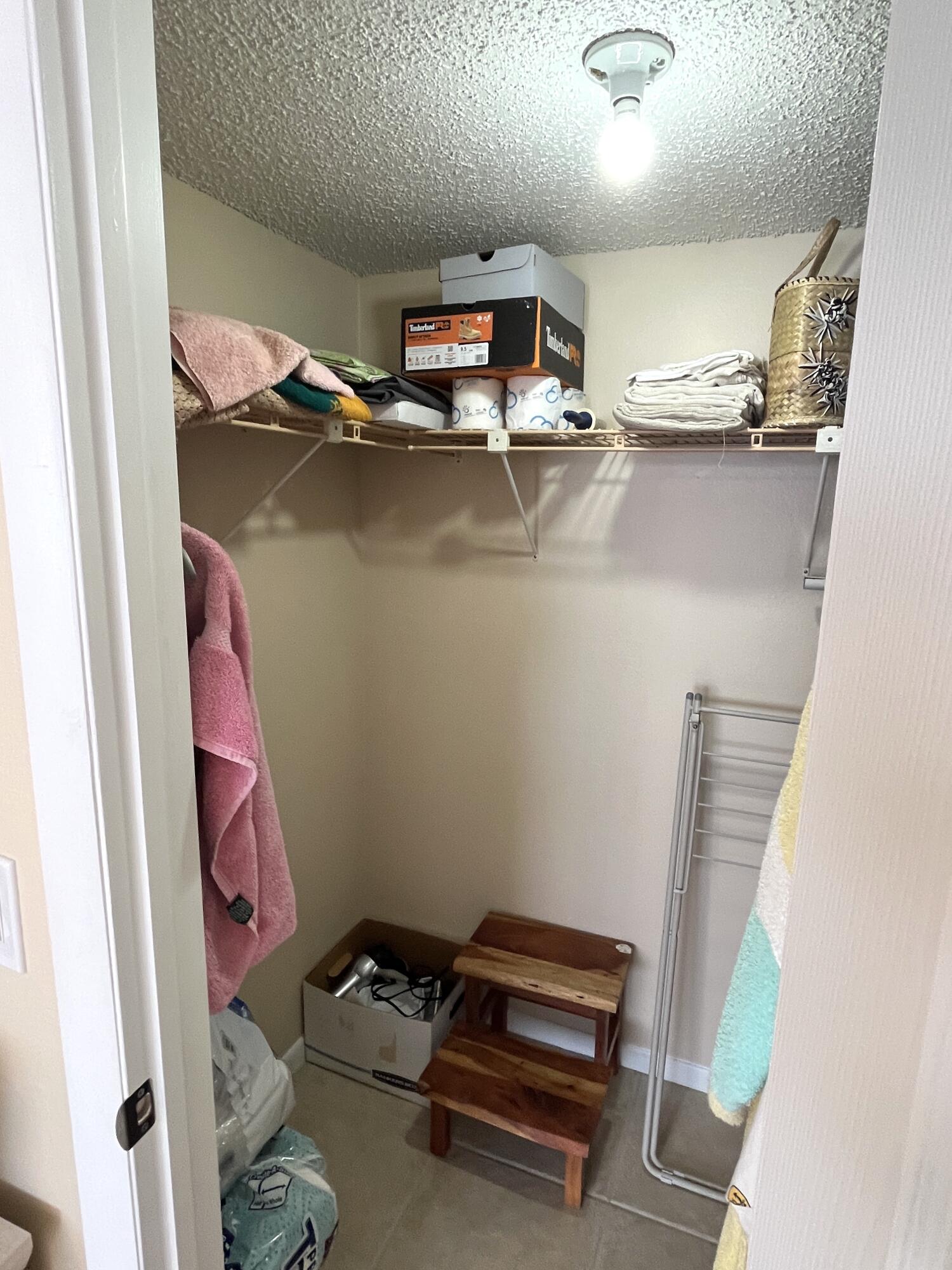 330 Northeast 26th Avenue, Unit 406 Boynton Beach, FL 33435 - Photo 12 of 33 a room with storage and utility