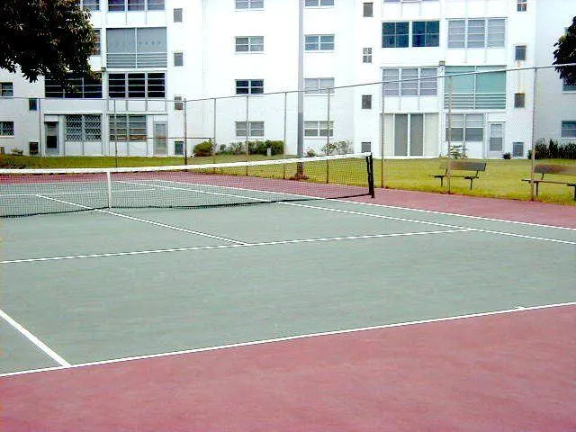 a view of a swimming pool with an outdoor space and seating area