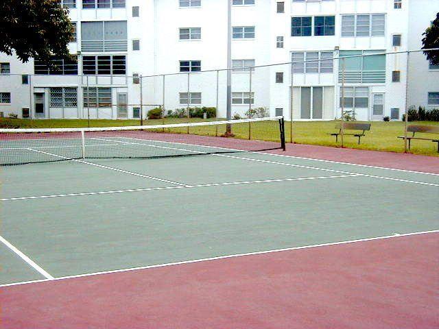 330 Northeast 26th Avenue, Unit 406 Boynton Beach, FL 33435 - Photo 29 of 33 a view of a swimming pool with an outdoor space and seating area