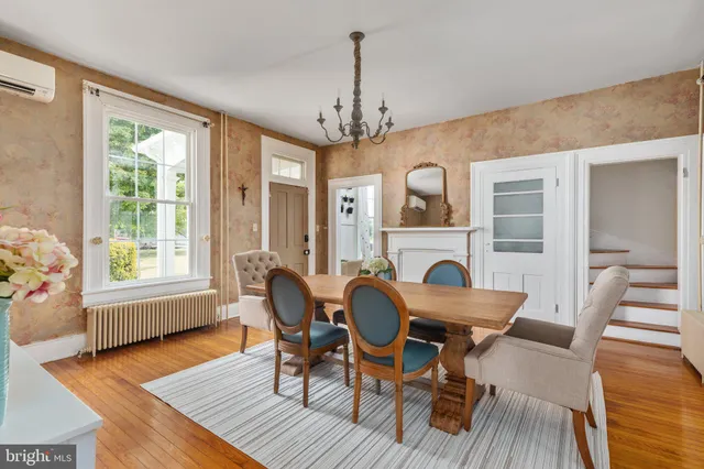 a bathroom with a toilet a sink and a mirror