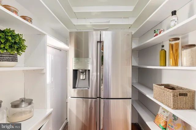 a bedroom with a bed and a dresser in it