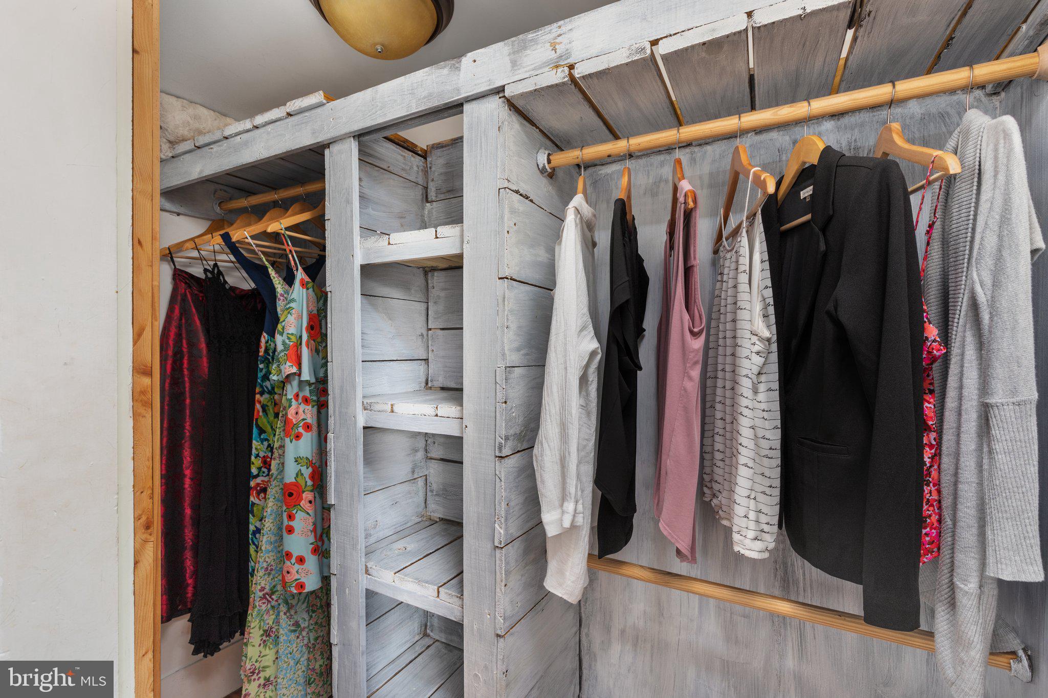2239 6th Street Middletown, VA 22645 - Photo 26 of 60 a view of walk in closet with clothes and shoes