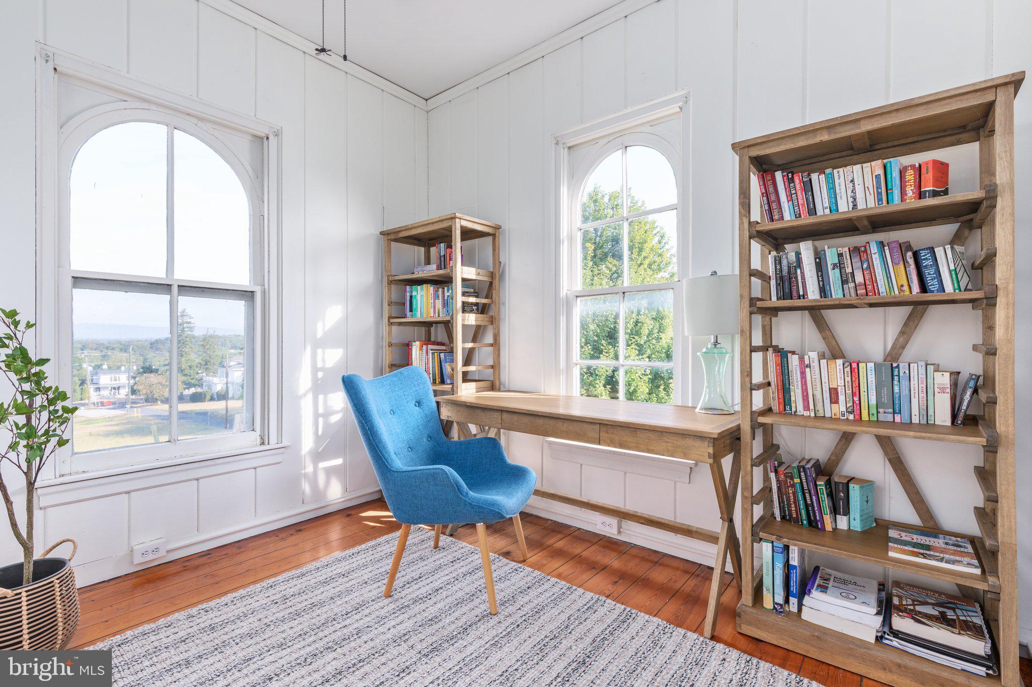 2239 6th Street Middletown, VA 22645 - Photo 36 of 60 a living room with furniture a bookshelf and a window