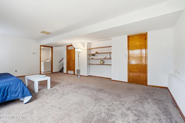 a view of a bedroom with closet and cabinet