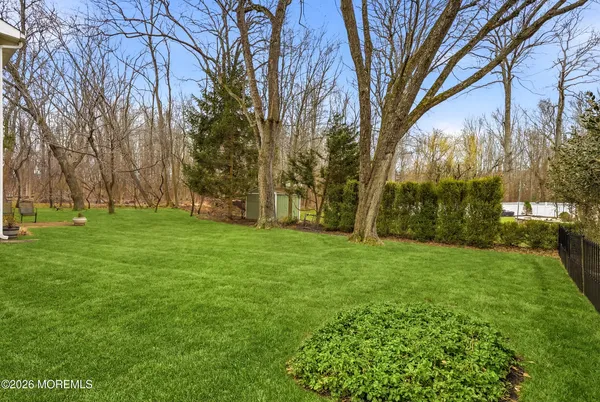 a backyard of a house with lots of green space