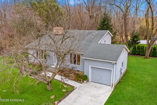 a aerial view of a house with a yard