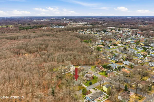 an aerial view of residential building and trees