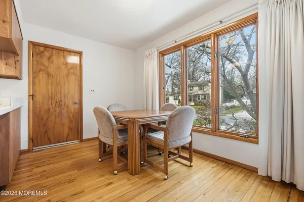 a dining room with furniture window wooden floor