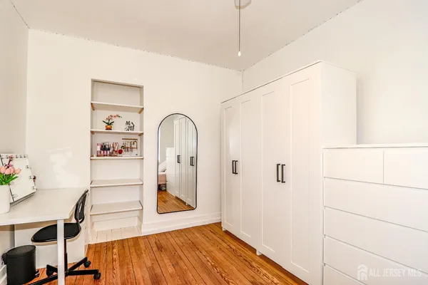 a view of a balcony with stairs and wooden fence