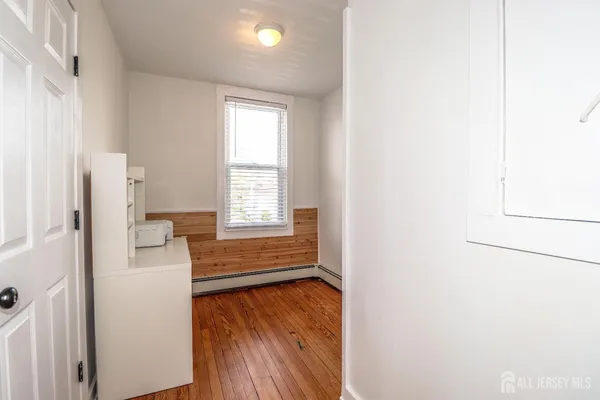 a view of furniture in wooden floor