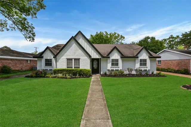 a front view of a house with yard