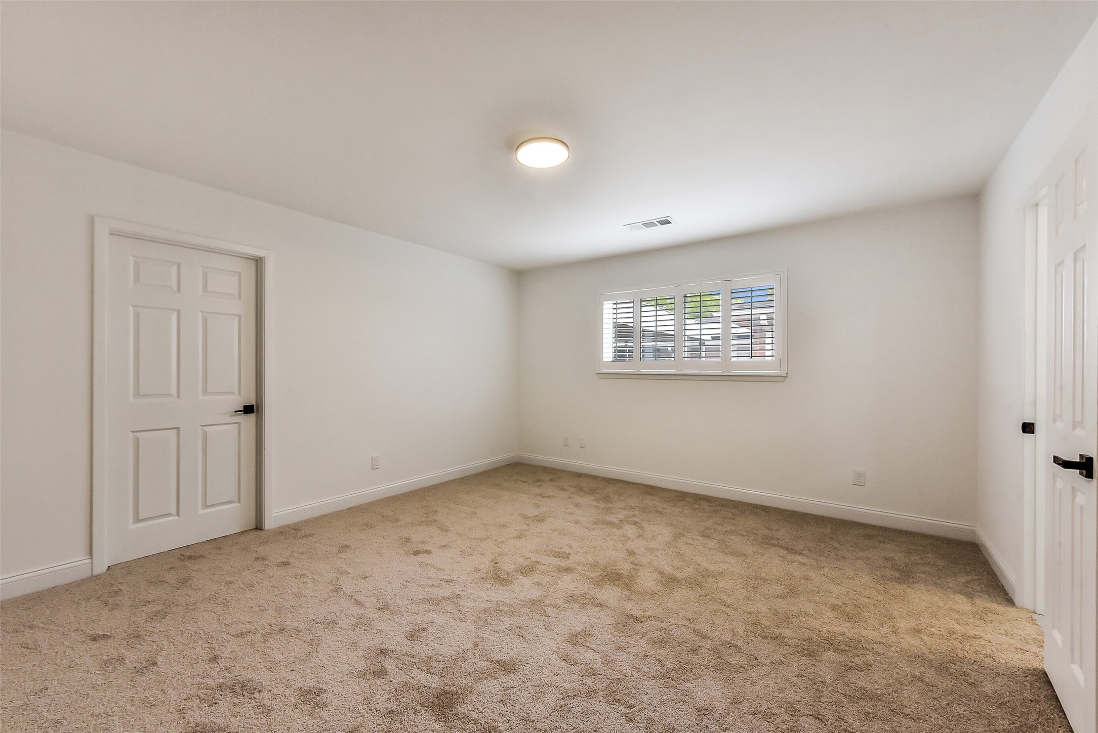 5946 Valkeith Drive Houston, TX 77096 - Photo 21 of 32 a view of an empty room with a window