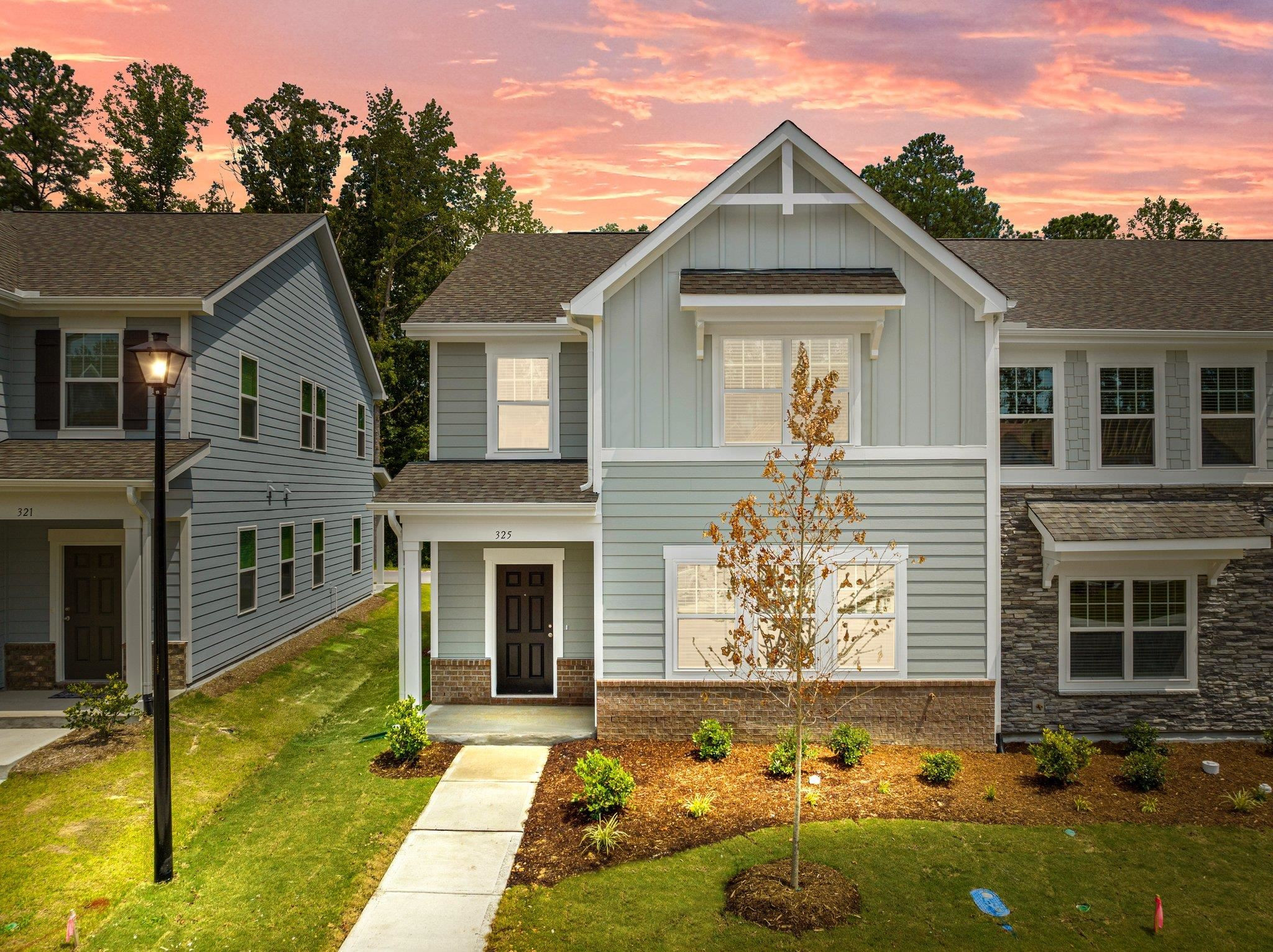 a front view of a house with a yard