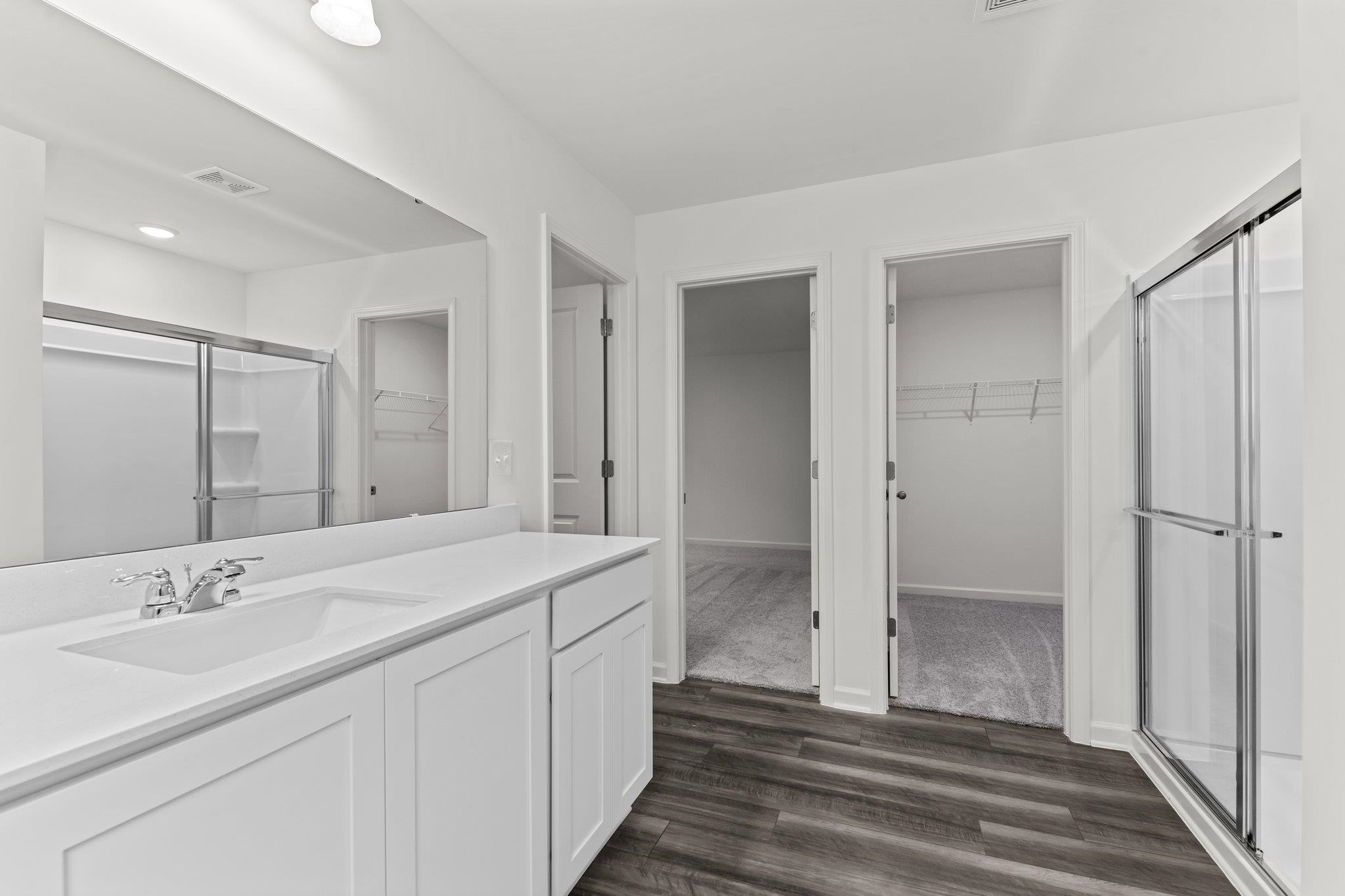 325 Spaight Acrs Way Wake Forest, NC 27587 - Photo 15 of 54 a bathroom with a sink and a mirror