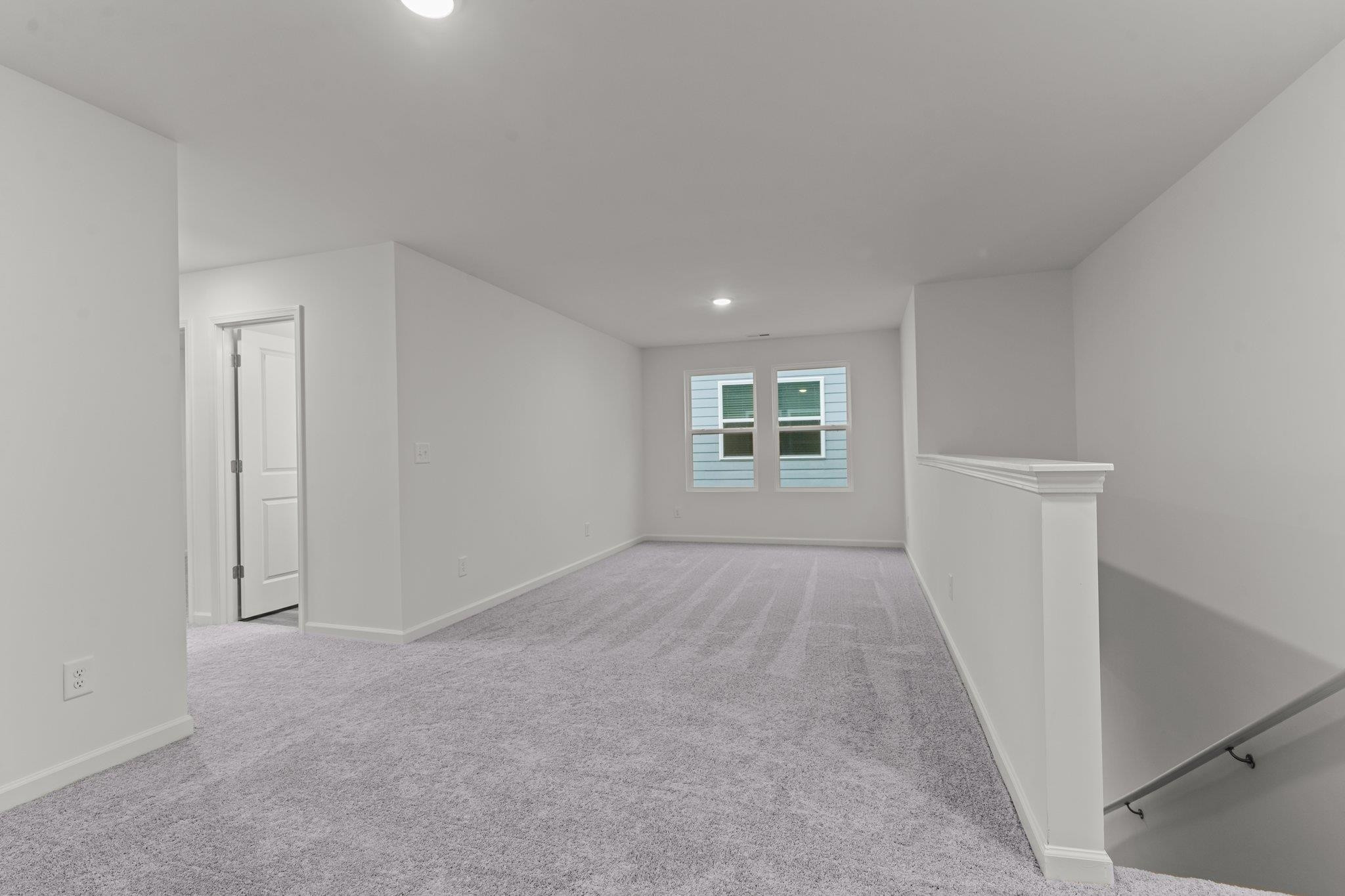 325 Spaight Acrs Way Wake Forest, NC 27587 - Photo 18 of 54 an empty room with windows