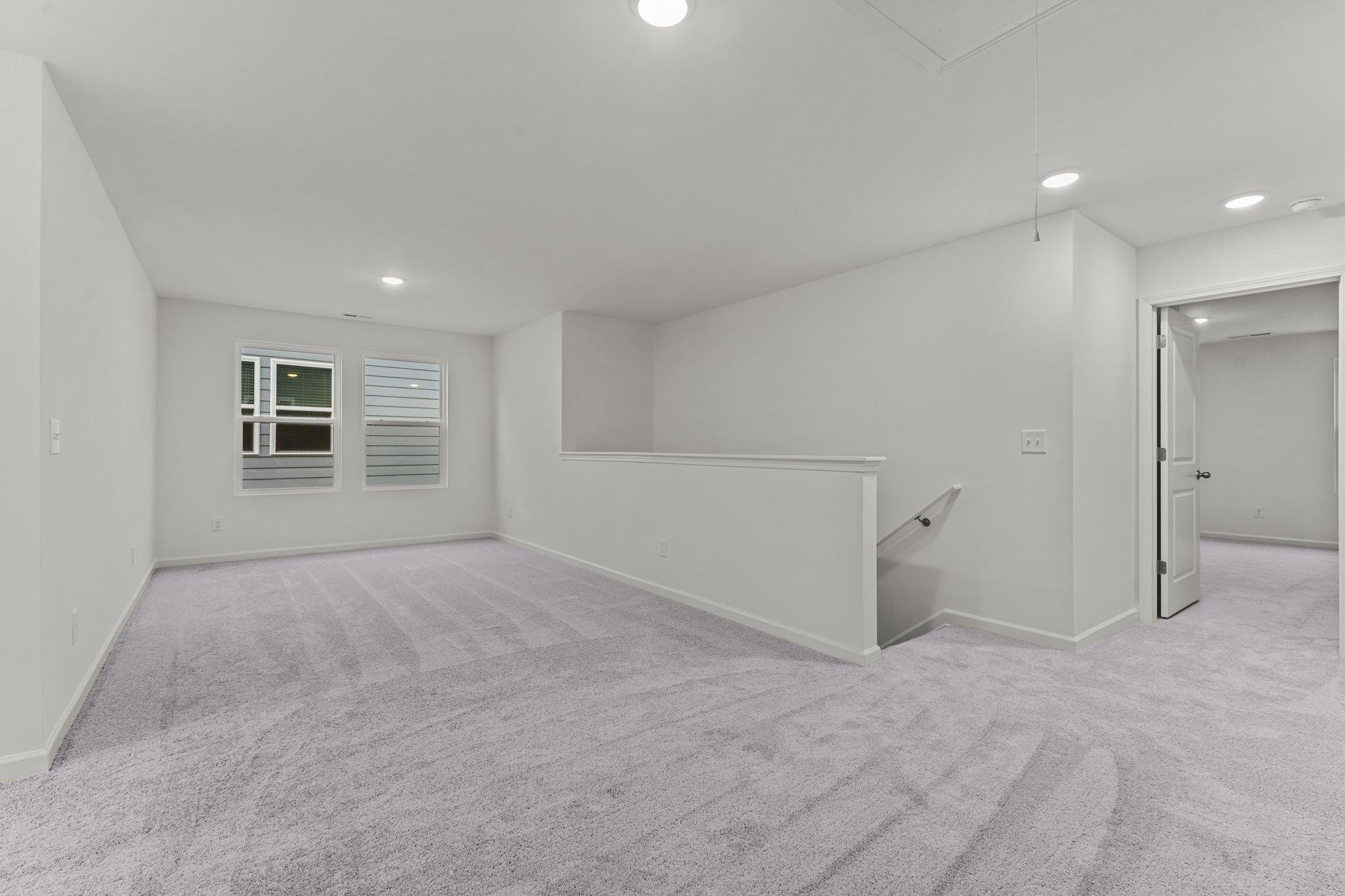 325 Spaight Acrs Way Wake Forest, NC 27587 - Photo 19 of 54 a view of an empty room with a window