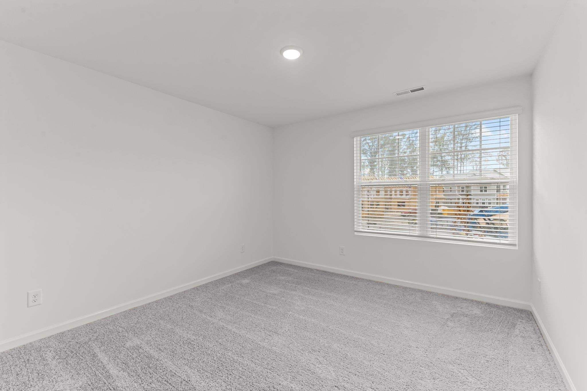 325 Spaight Acrs Way Wake Forest, NC 27587 - Photo 22 of 54 an empty room with a window