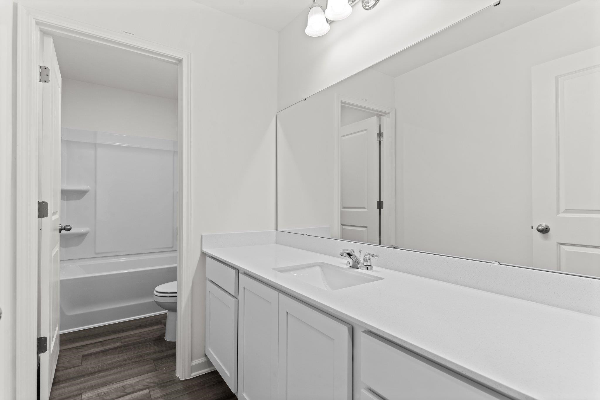 325 Spaight Acrs Way Wake Forest, NC 27587 - Photo 23 of 54 a bathroom with a sink double vanity and tub