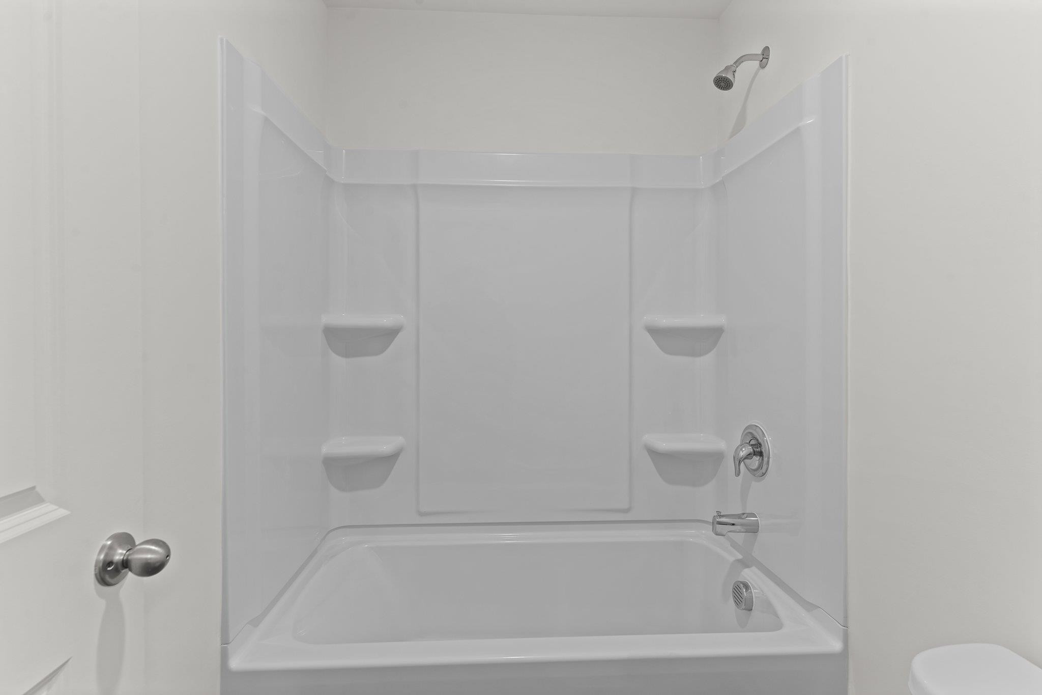 325 Spaight Acrs Way Wake Forest, NC 27587 - Photo 24 of 54 a bathroom with a bathtub