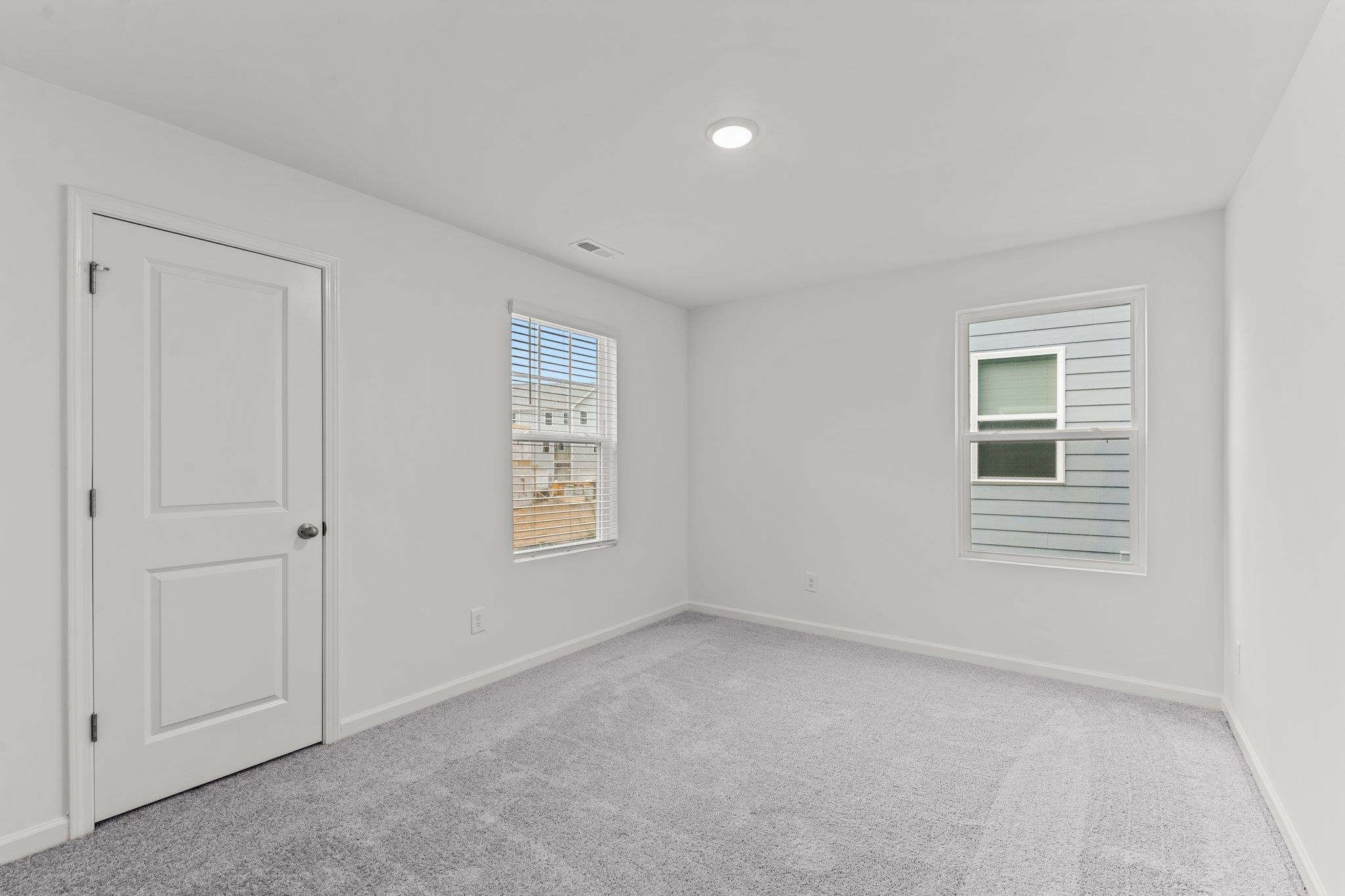 325 Spaight Acrs Way Wake Forest, NC 27587 - Photo 25 of 54 a view of an empty room with a window