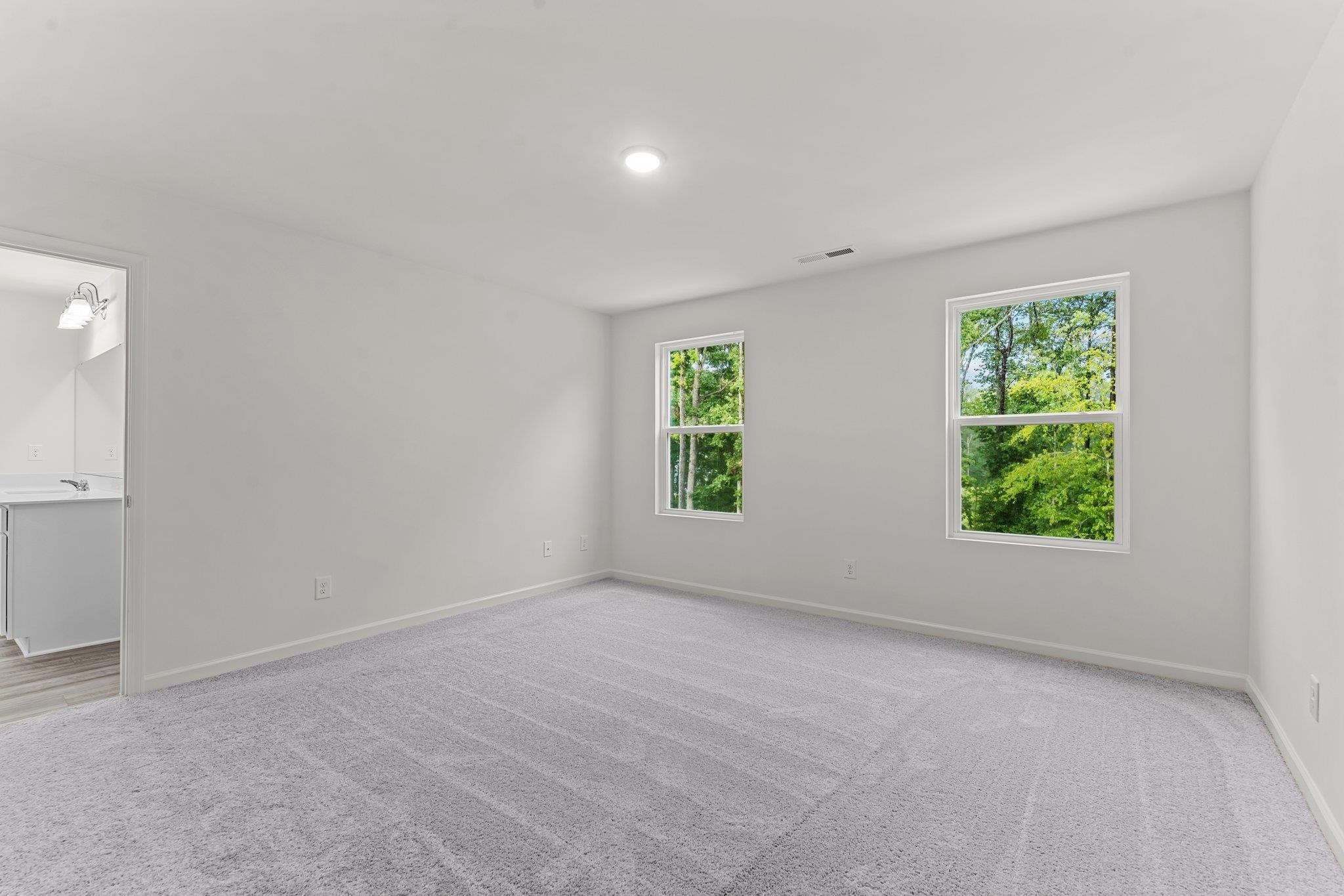 325 Spaight Acrs Way Wake Forest, NC 27587 - Photo 26 of 54 an empty room with windows