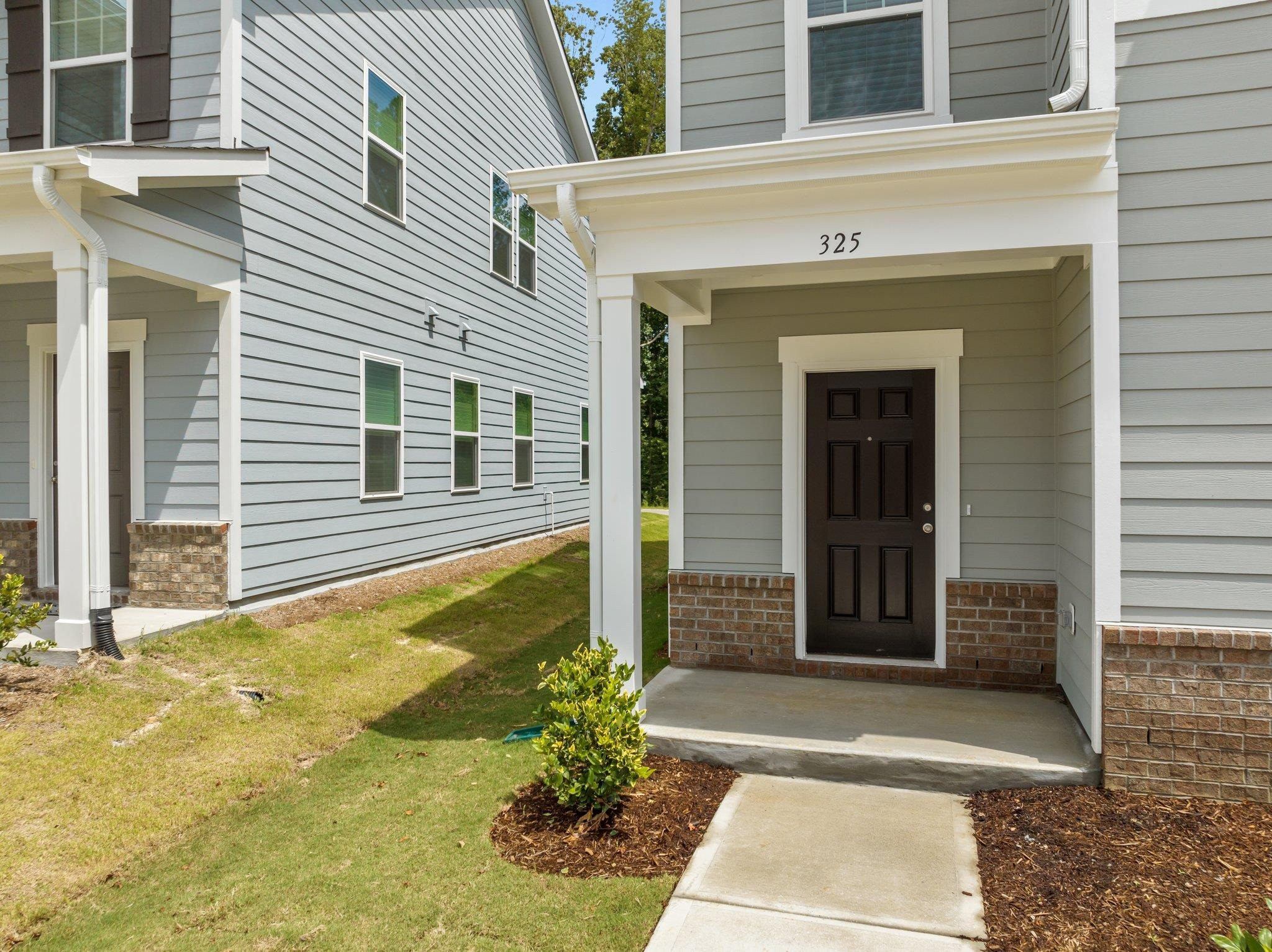 325 Spaight Acrs Way Wake Forest, NC 27587 - Photo 40 of 54 a view of a house with potted plants