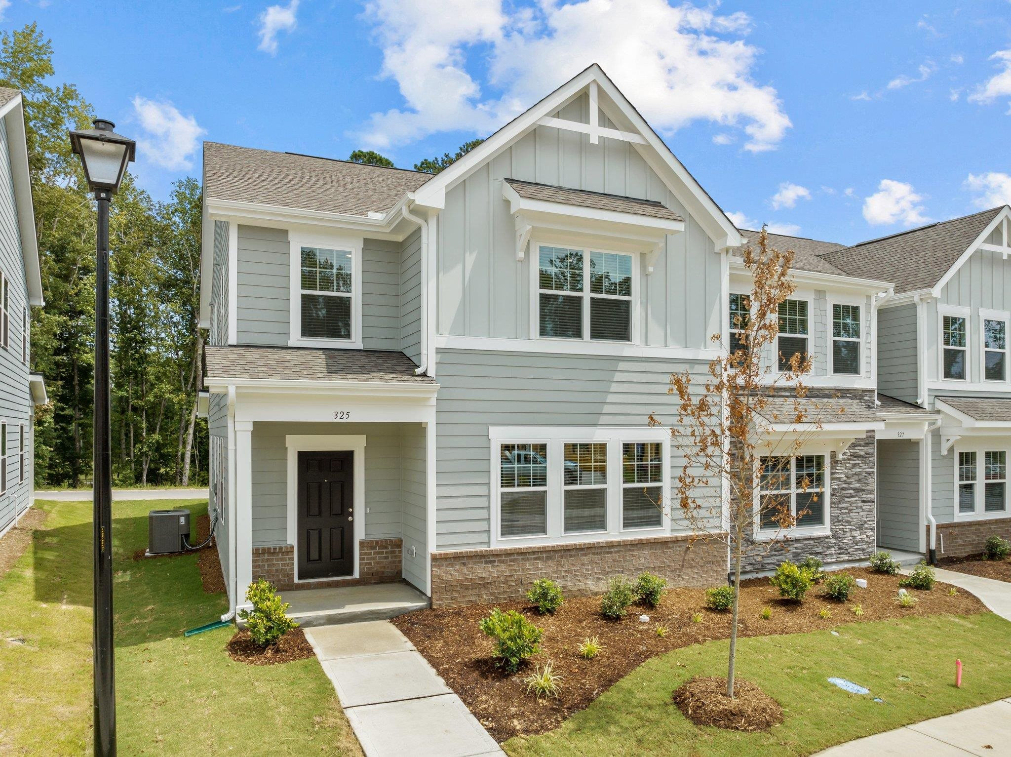 325 Spaight Acrs Way Wake Forest, NC 27587 - Photo 41 of 54 a front view of a house with a yard