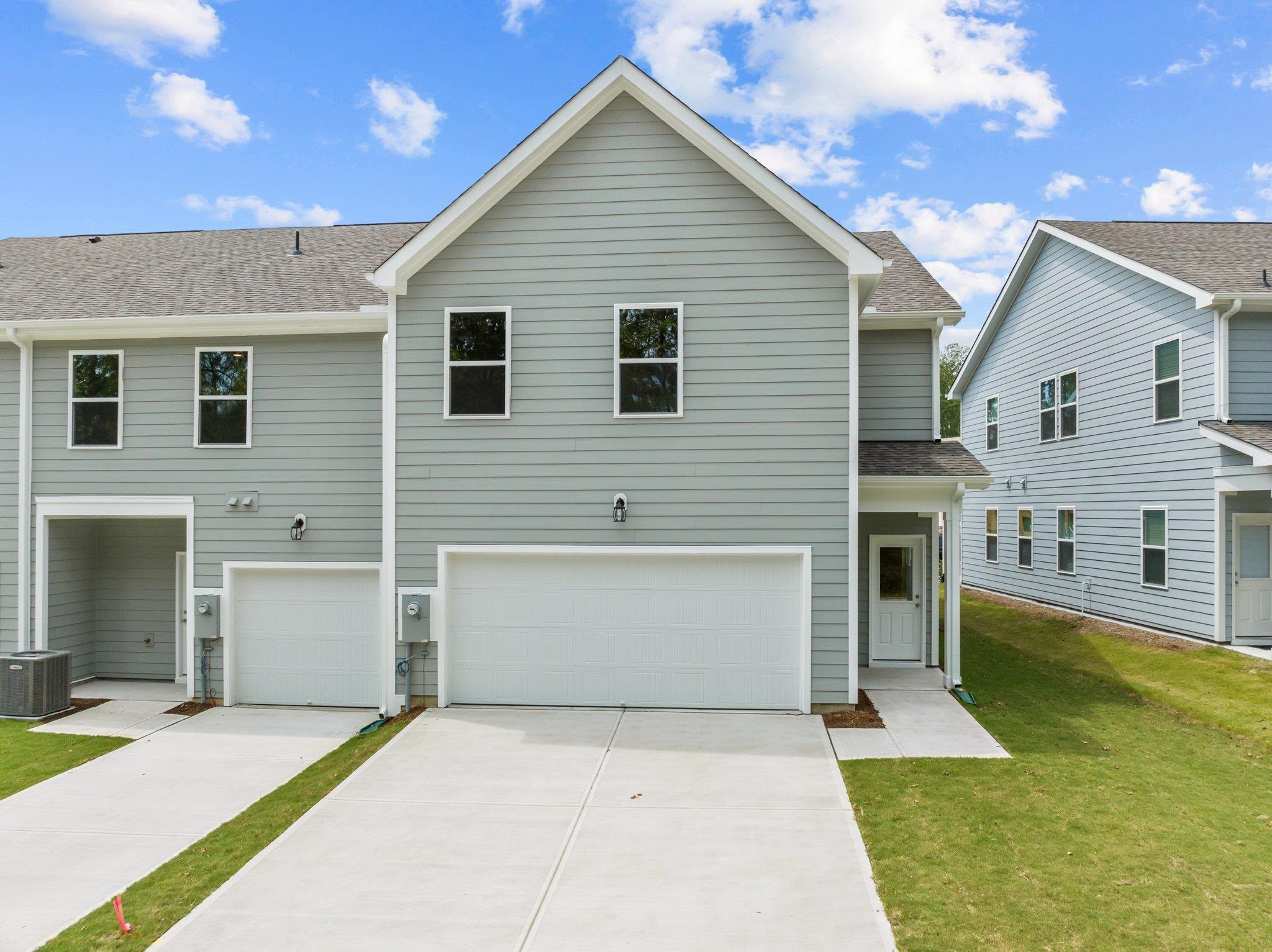 325 Spaight Acrs Way Wake Forest, NC 27587 - Photo 43 of 54 a front view of a house with a yard and garage