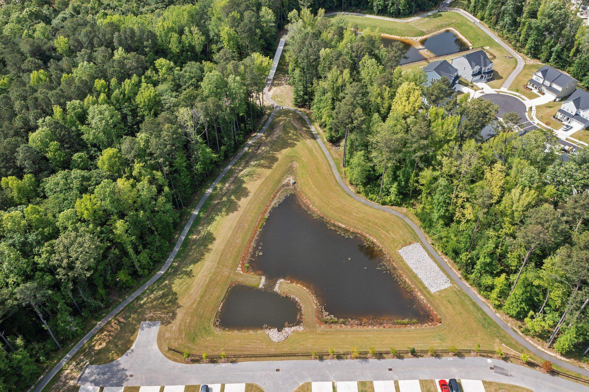 325 Spaight Acrs Way Wake Forest, NC 27587 - Photo 52 of 54 a view of a house with a yard and plants