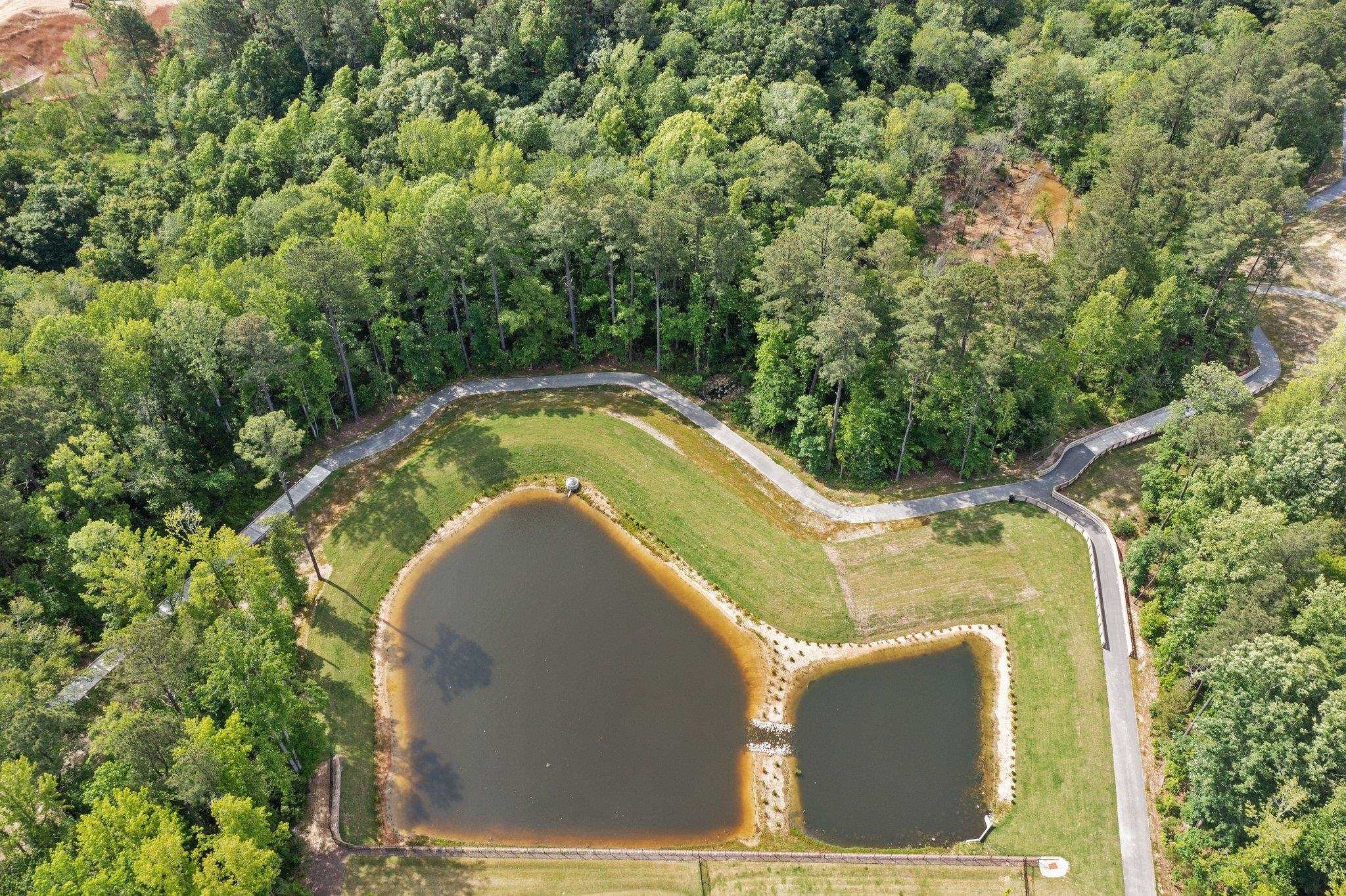 325 Spaight Acrs Way Wake Forest, NC 27587 - Photo 53 of 54 a view of a swimming pool in a backyard