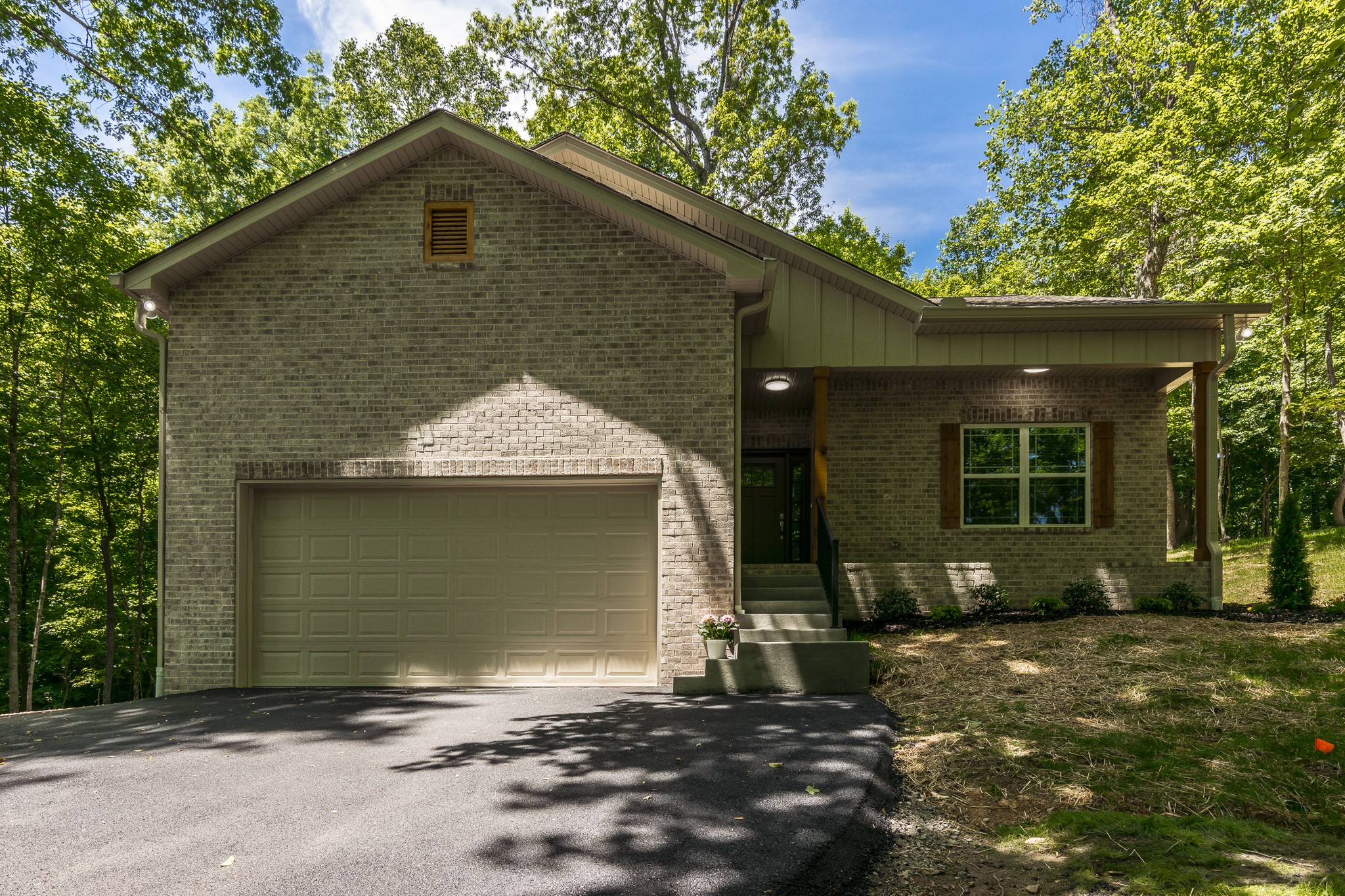 1566 Old Gallatin Road Portland, TN 37148 - Photo 1 of 49 a front view of a house with a yard