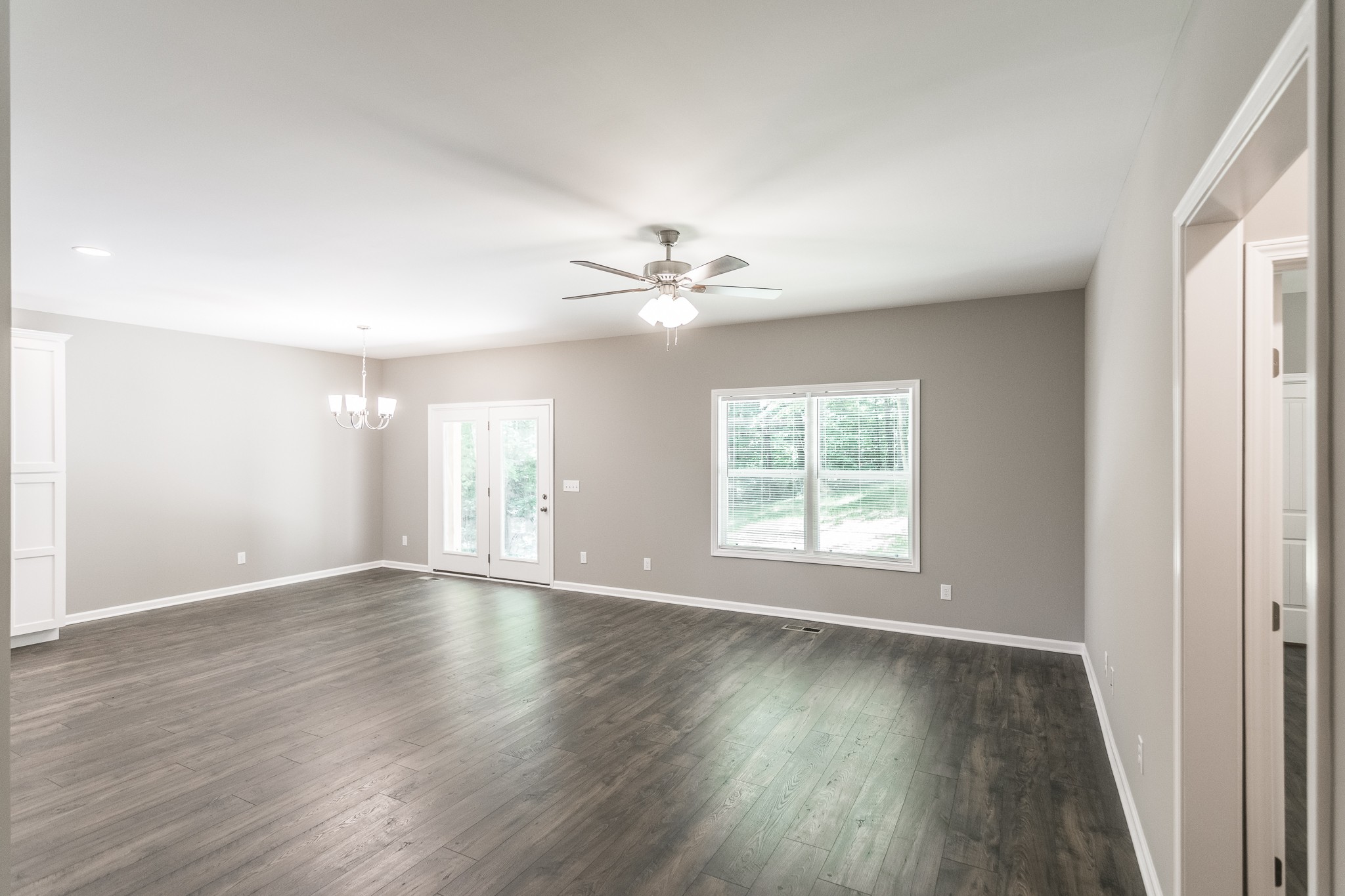 1566 Old Gallatin Road Portland, TN 37148 - Photo 19 of 49 an empty room with wooden floor and windows