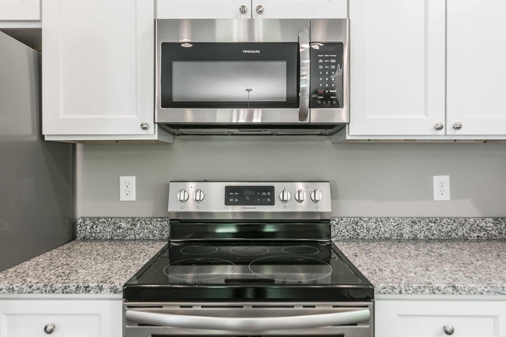 1566 Old Gallatin Road Portland, TN 37148 - Photo 28 of 49 a kitchen with stainless steel appliances granite countertop a stove and a microwave