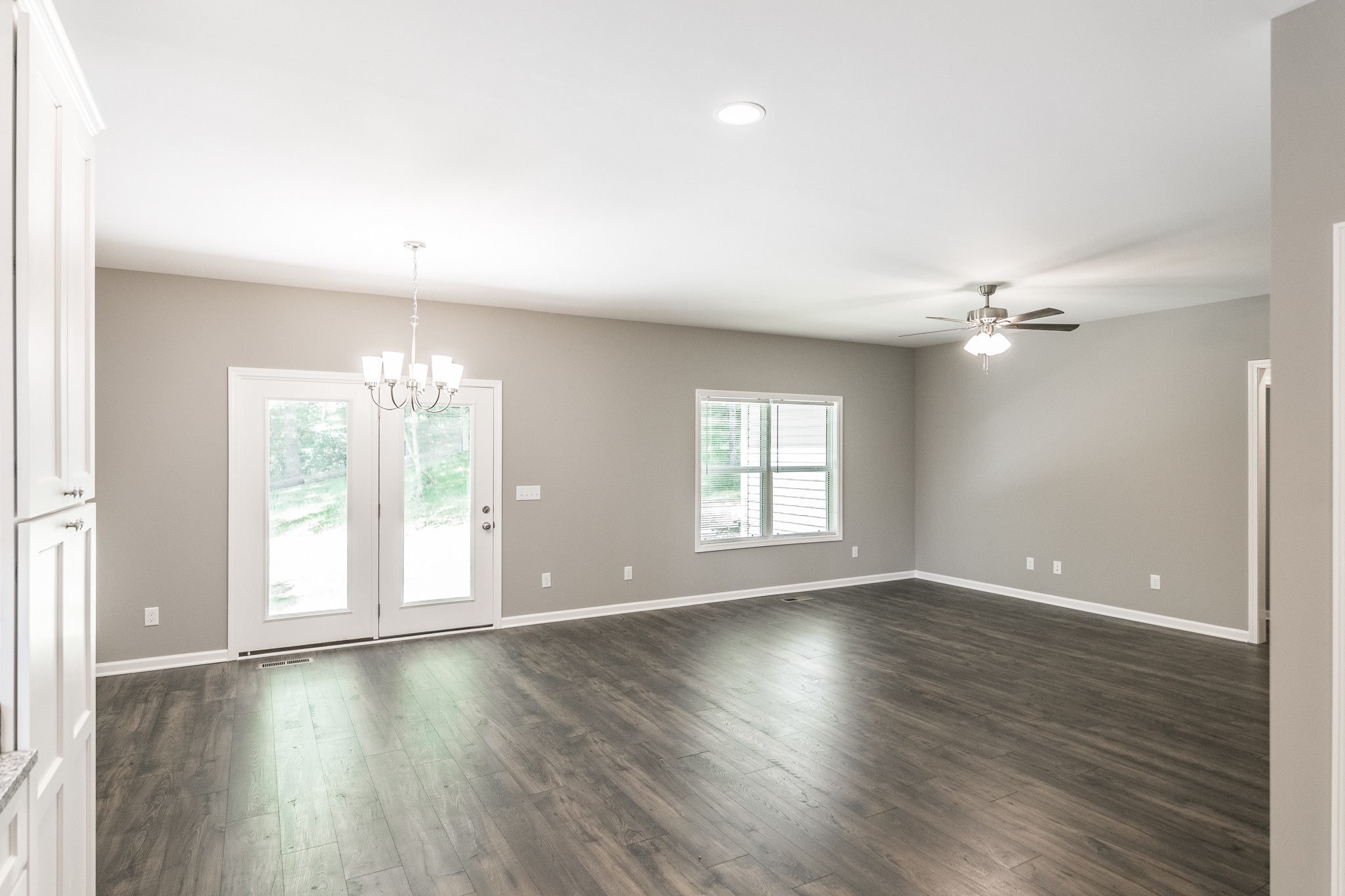 1566 Old Gallatin Road Portland, TN 37148 - Photo 30 of 49 an empty room with wooden floor and windows