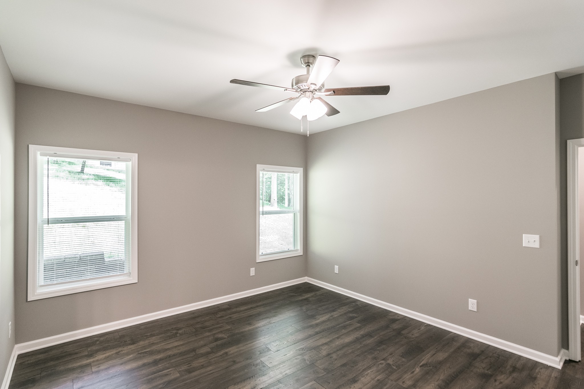 1566 Old Gallatin Road Portland, TN 37148 - Photo 36 of 49 a view of an empty room with chandelier fan and wooden floor