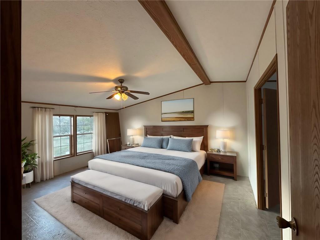 137 Lucas Pipeline Road Ruffs Dale, PA 15679 - Photo 33 of 35 a spacious bedroom with a large bed and a chandelier