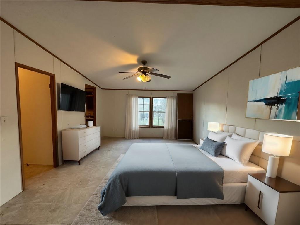 137 Lucas Pipeline Road Ruffs Dale, PA 15679 - Photo 10 of 35 a spacious bedroom with a bed and a couch