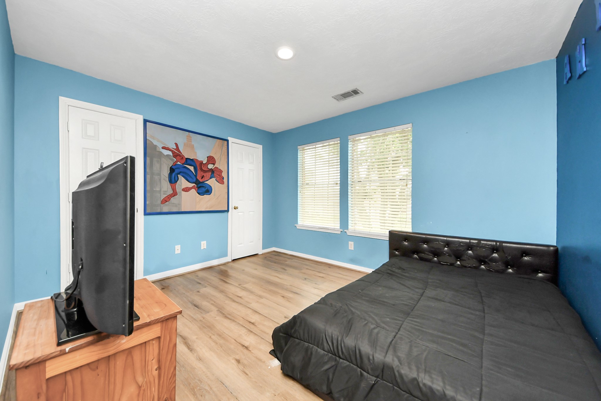 23814 Spring Dane Drive Spring, TX 77373 - Photo 35 of 41 a bedroom with a bed and a flat screen tv